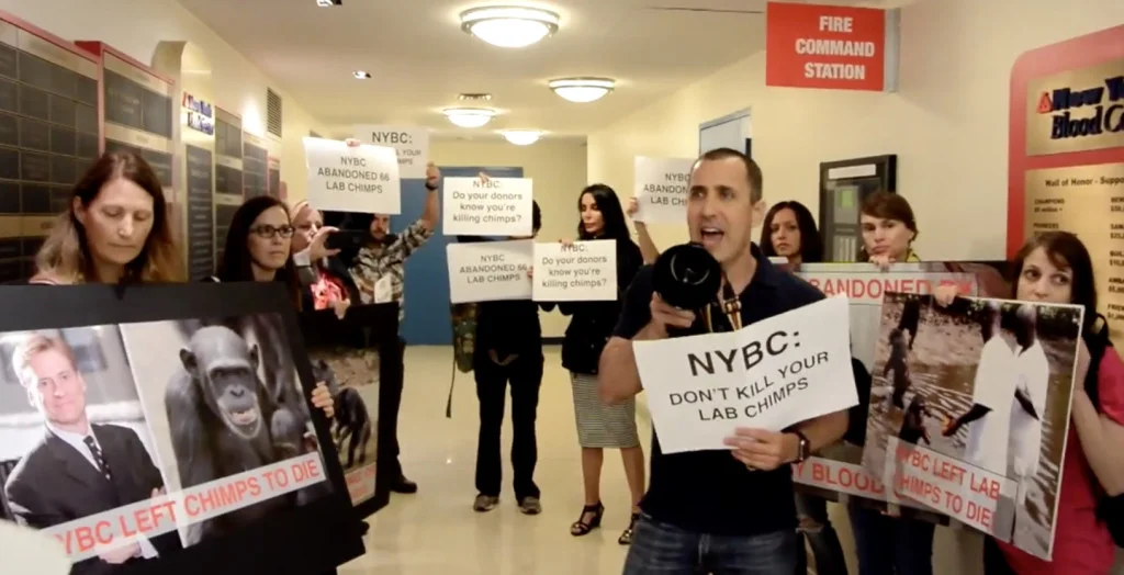 Donny Moss & fellow activists stage disruption inside New York Blood Center. Source: Their Turn .