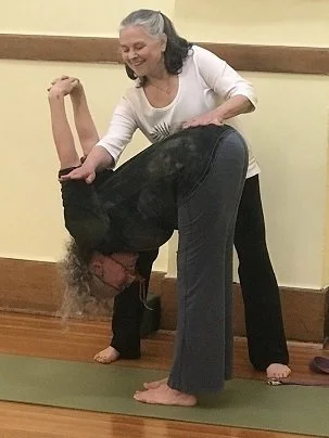 Assisted Uttanasana with hand clasp.jpg