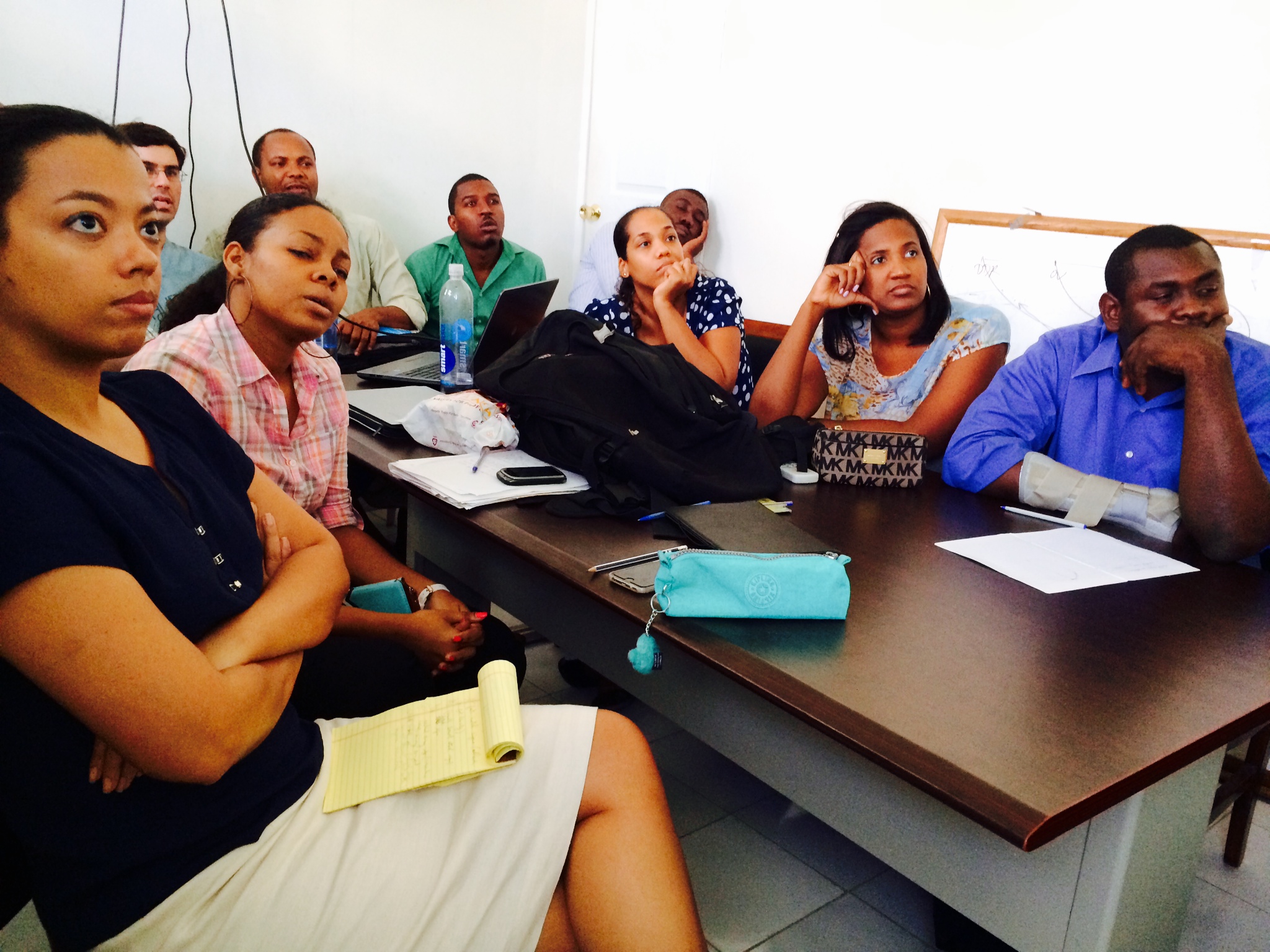 Residents listening eagerly during a small bowel obstruction lecture