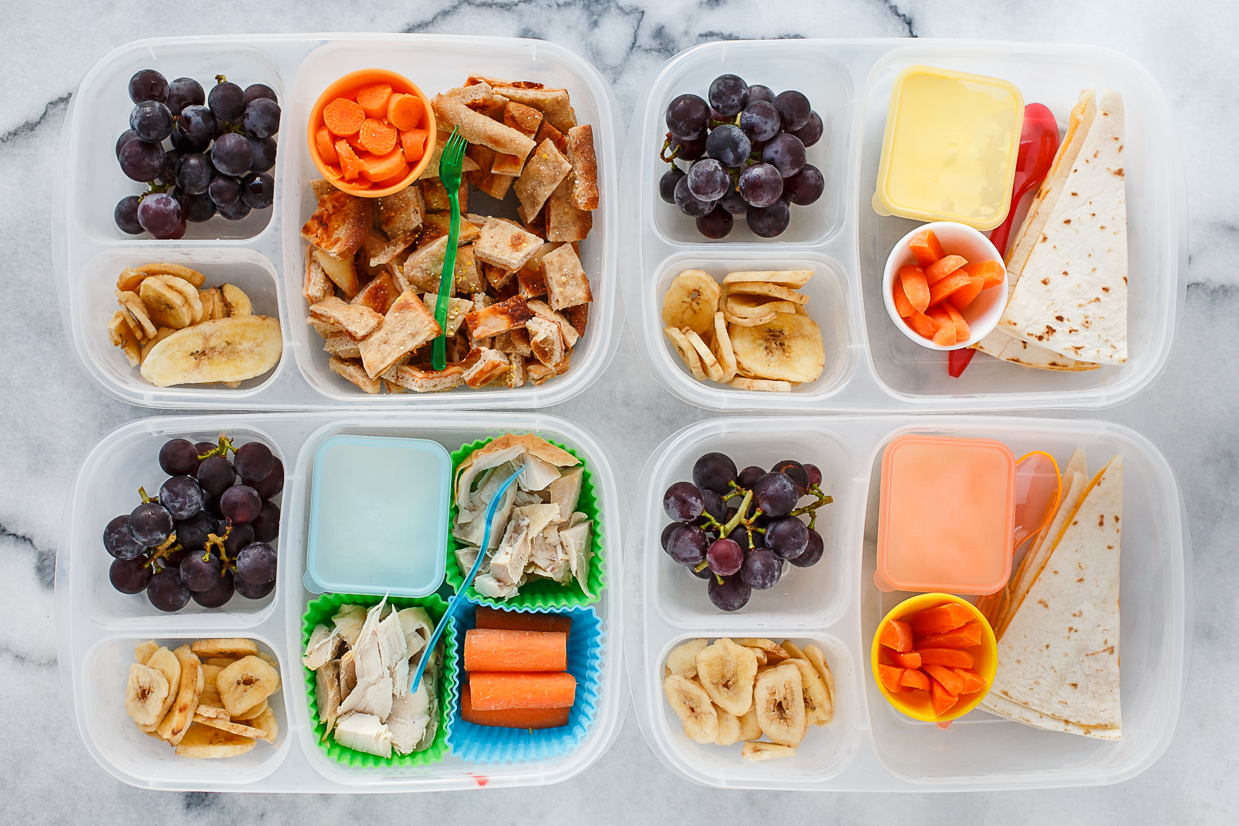 Monday: A little bit of weekend leftover cleanout. Two have quesadillas left from sunday lunch, with sour cream for dipping. One has leftover roast chicken with mayo for dipping. And the fourth has leftover homemade pizza, cut into bites. They all have carrots, dried bananas and grapes. 