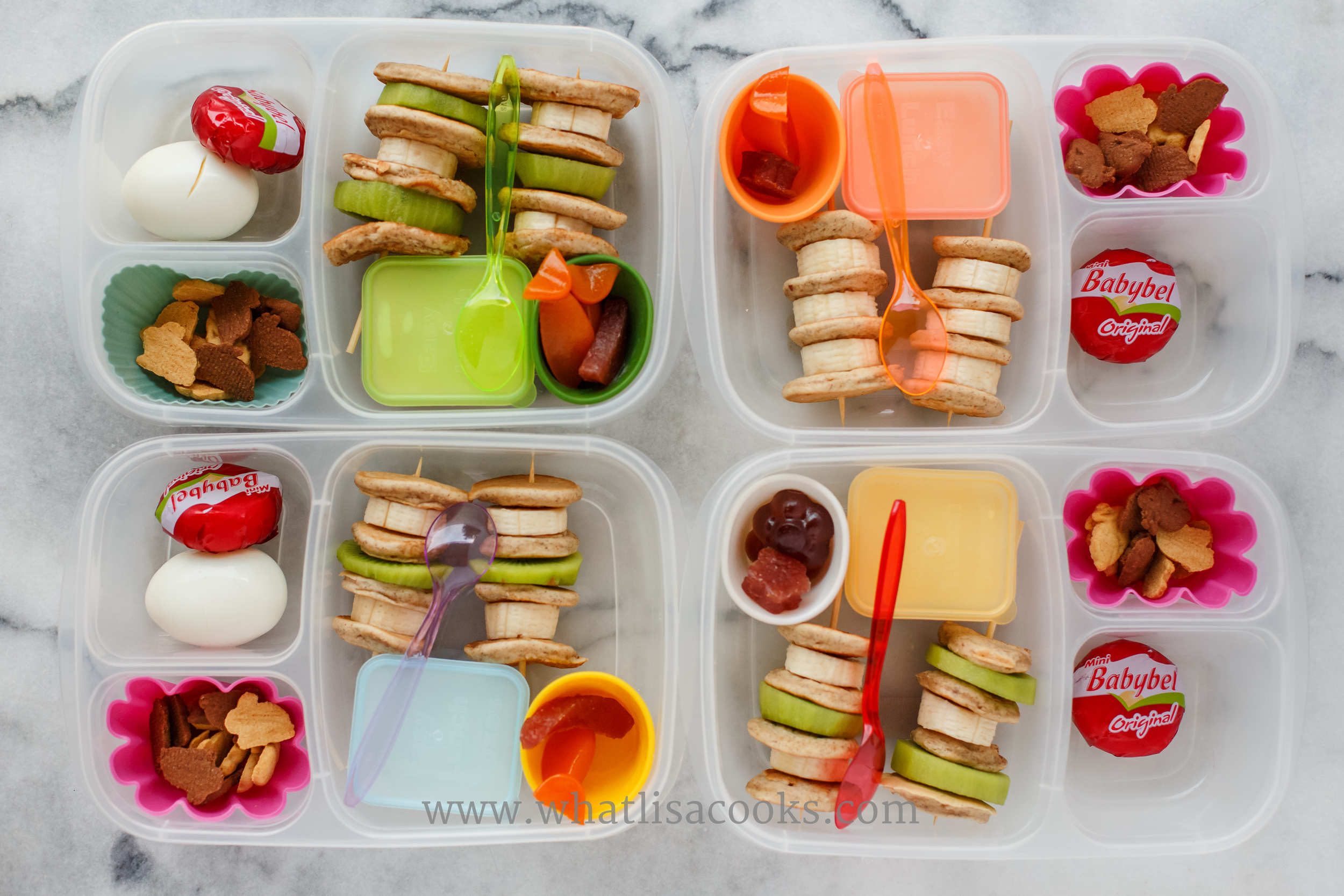 Breakfast for lunch: mini pancake kebobs with kiwi and banana, maple syrup yogurt for dipping, gummies, cheese, boiled egg, and a few bunny grahams.