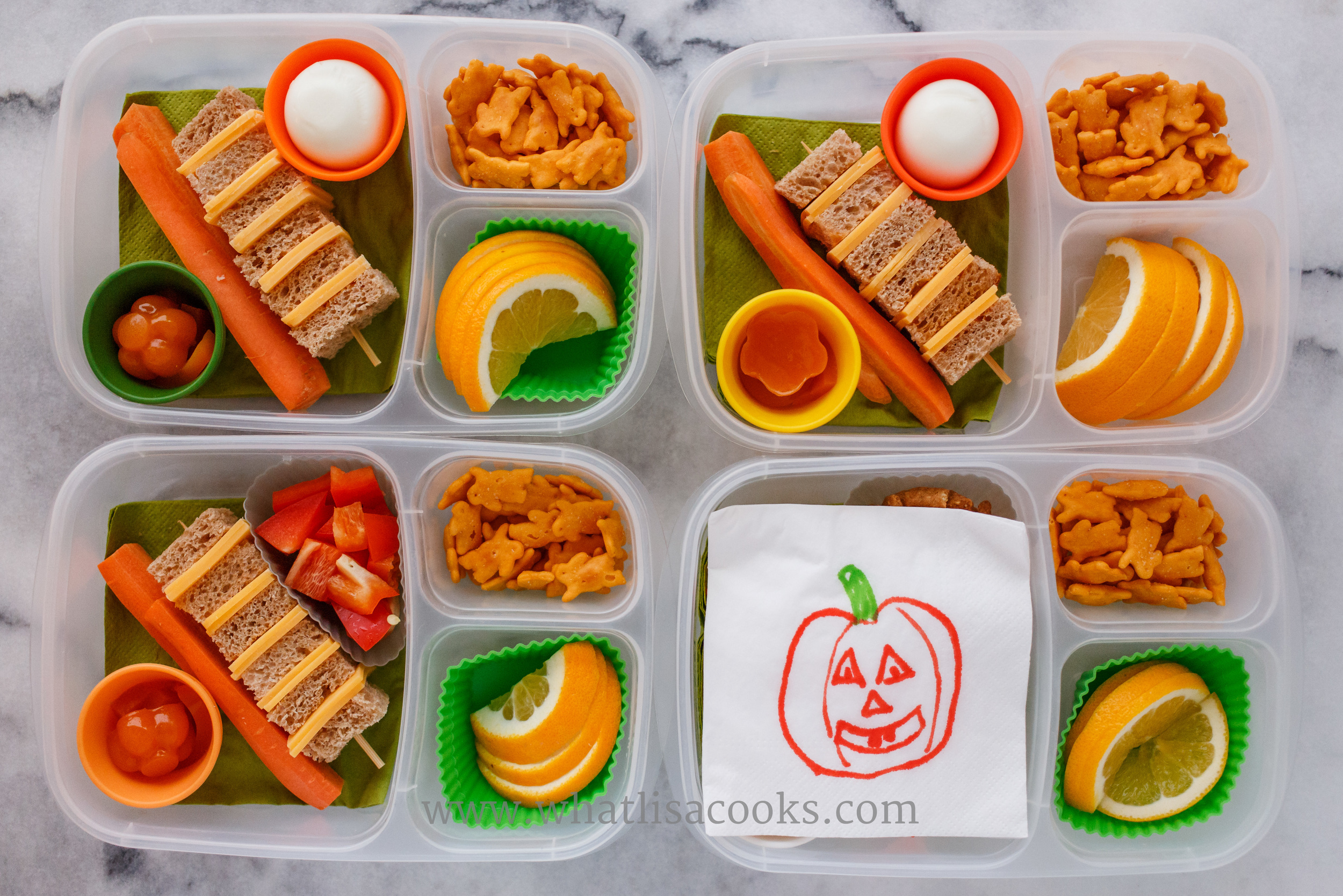 A very quick and simple Halloween lunch of all orange foods. Cheddar cheese mini sandwiches on a skewer, carrots, oranges, cheddar bunnies, and orange gel gummies. 