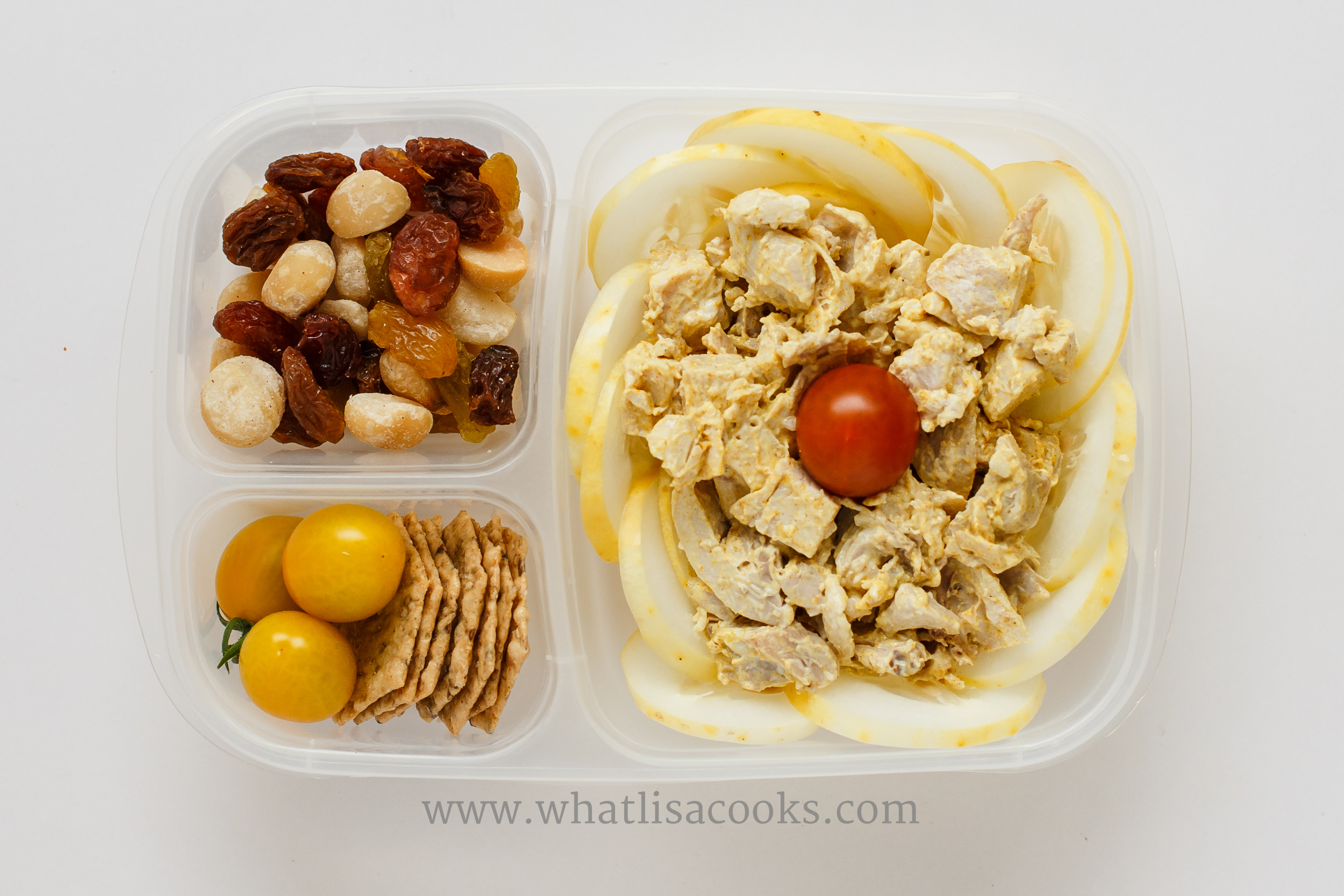 Curry chicken salad: leftover roasted chicken, mayo, curry powder and salt. With sliced yellow cucumbers, tomatoes, rice crackers, raisins and macadamia nuts. 