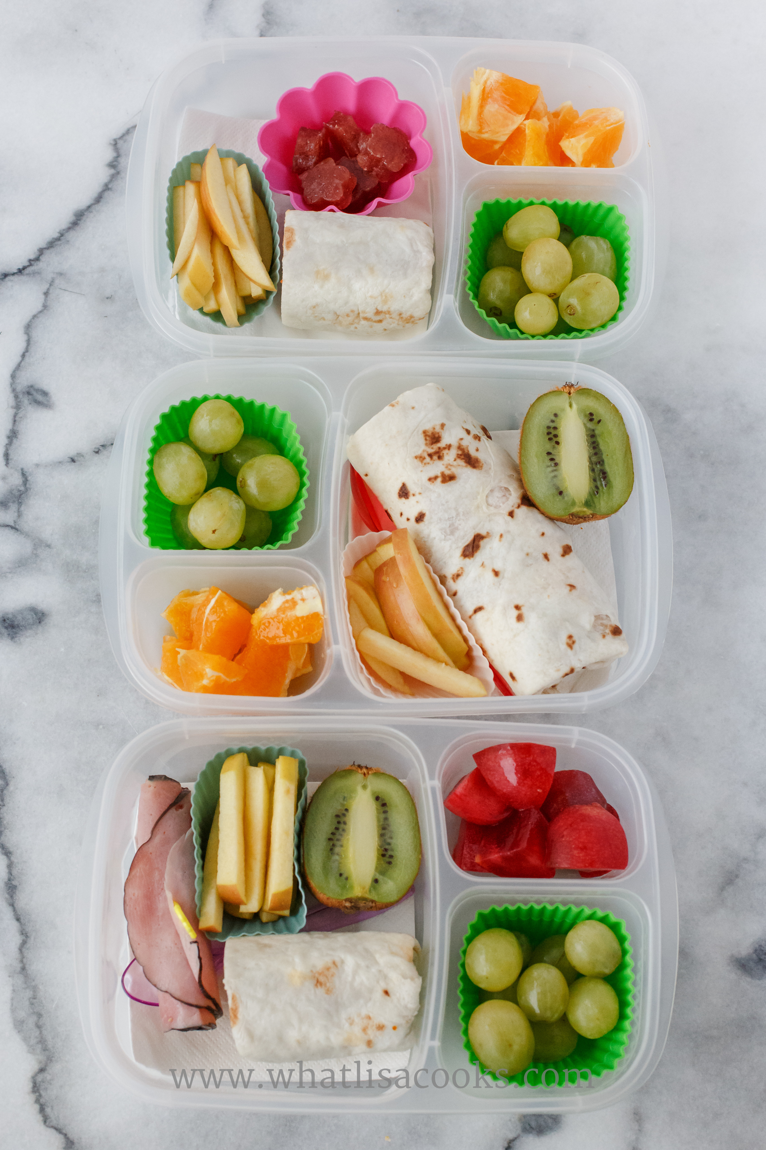 Bean and cheese burritos, grapes, apples. One has sliced ham, kiwi and plum. One has orange bites and kiwi. One has orange bites and raspberry gummies.