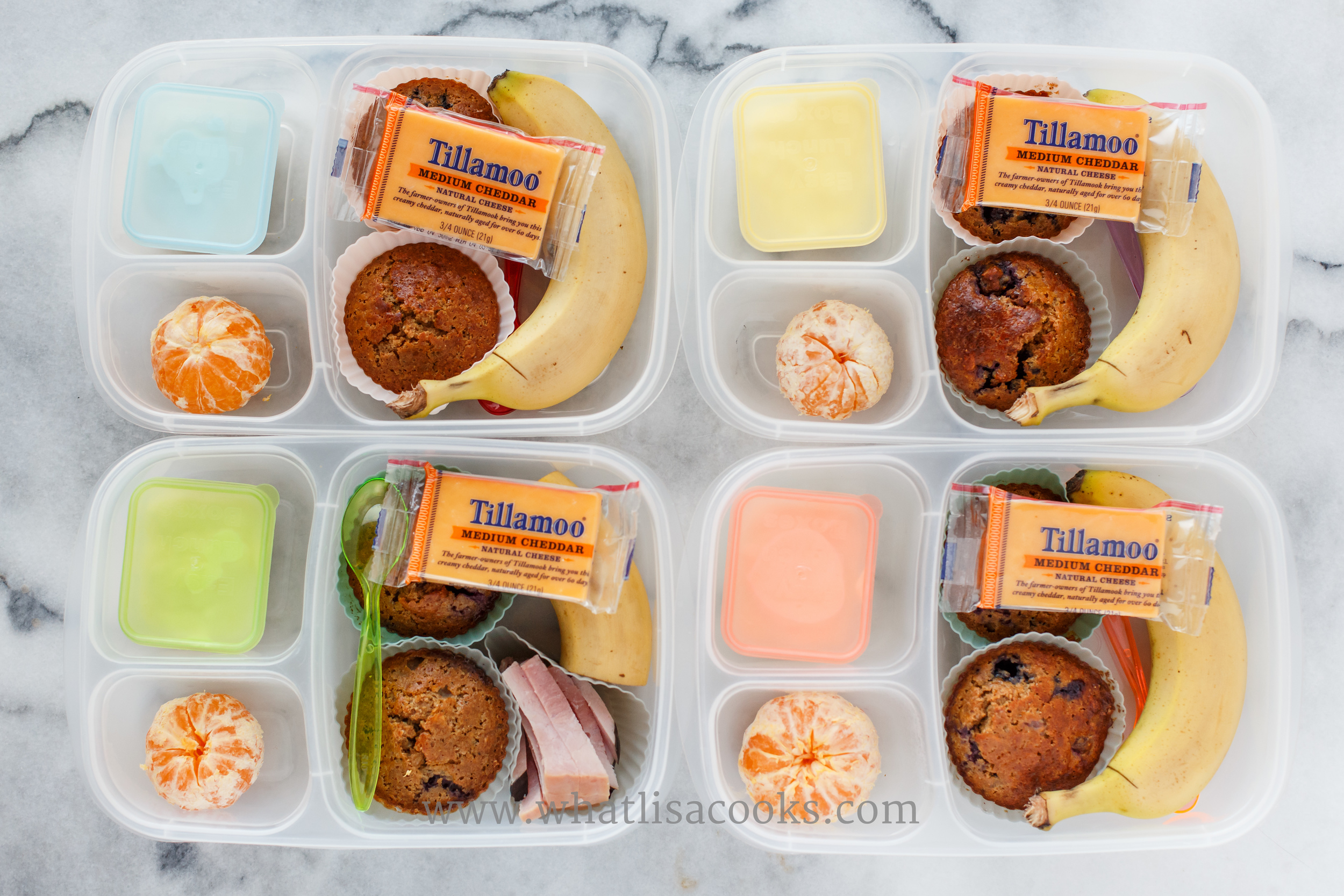 Breakfast for lunch. Whole wheat blueberry muffins from the freezer, banana, orange, yogurt, and one has some ham. 