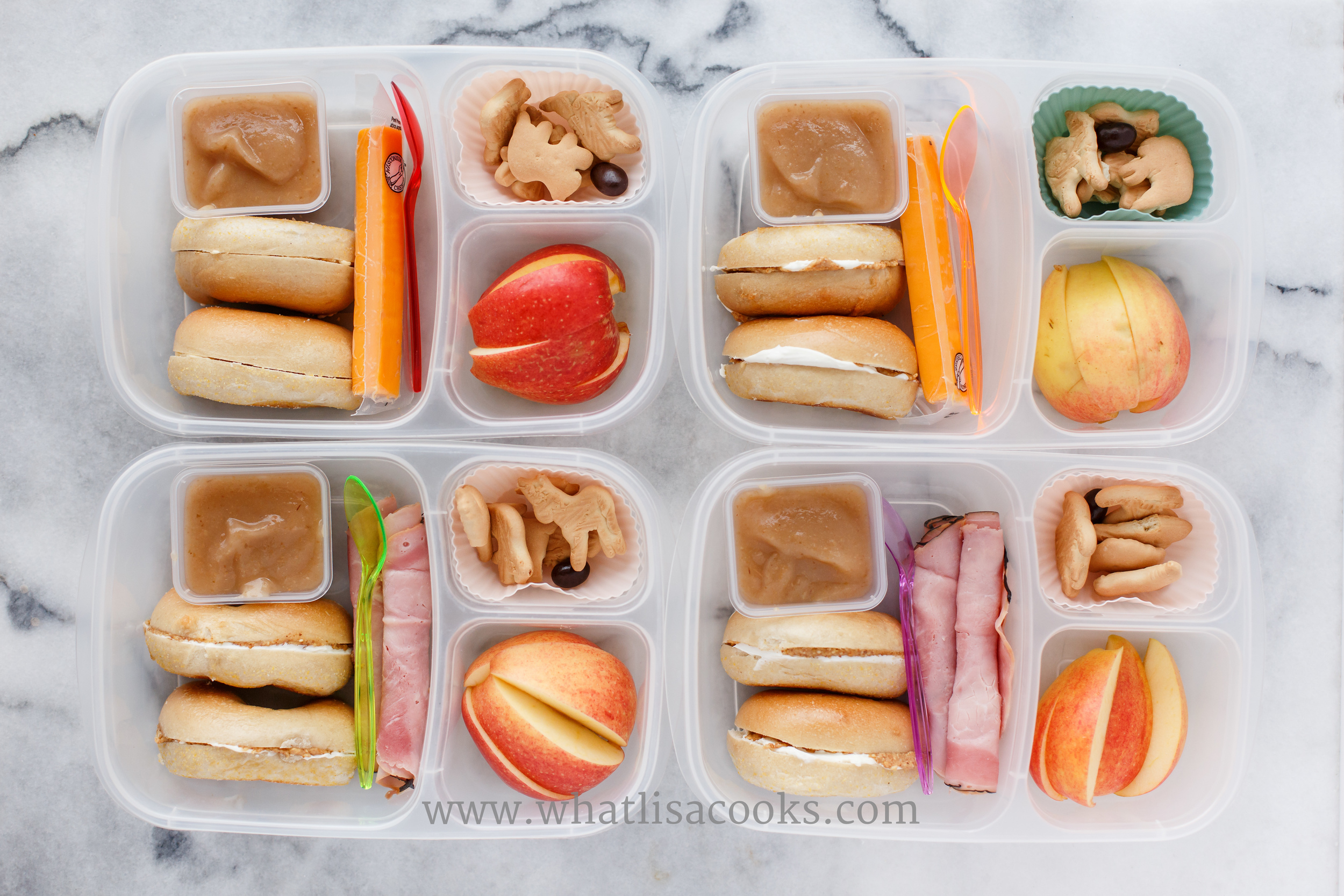 Bagels with cream cheese and almond butter for three (one had just butter), with homemade applesauce, ham or a cheese stick, apples, animal crackers, and one little dark chocolate covered edamame bean. 