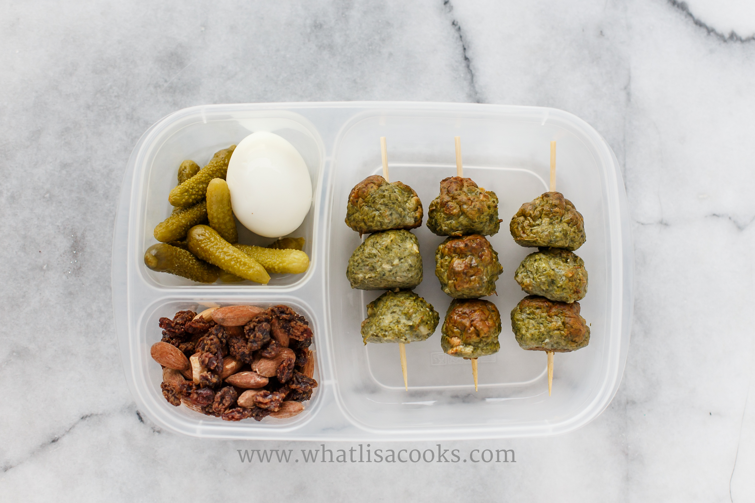 A yummy lunch for me. Meatballs with sausage, mushrooms and kale. Boiled egg, pickles, almonds and raisins. 