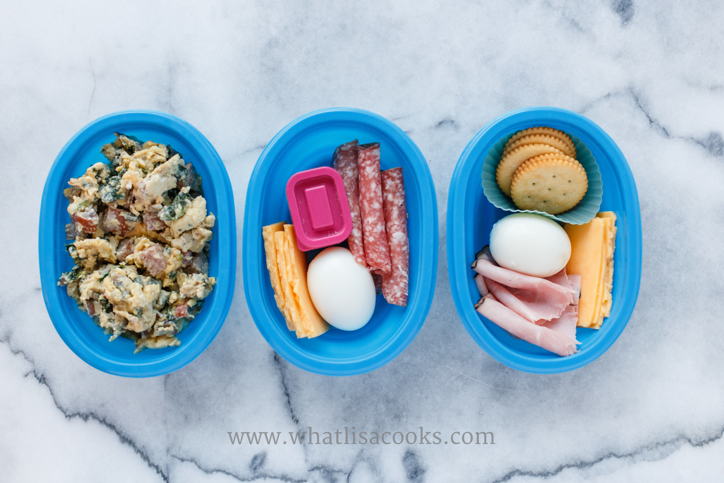This was a breakfast and snack. My breakfast doesn't look very appealing here, but it was really good. Scrambled eggs with polish sausage, spinach, mushrooms, onions, and cheese. In the middle was my lunch - salami, boiled egg, cheese, and salt for the egg in the pink container. On the right was a mid-morning snack for my son - ham, cheese, egg, and crackers. 