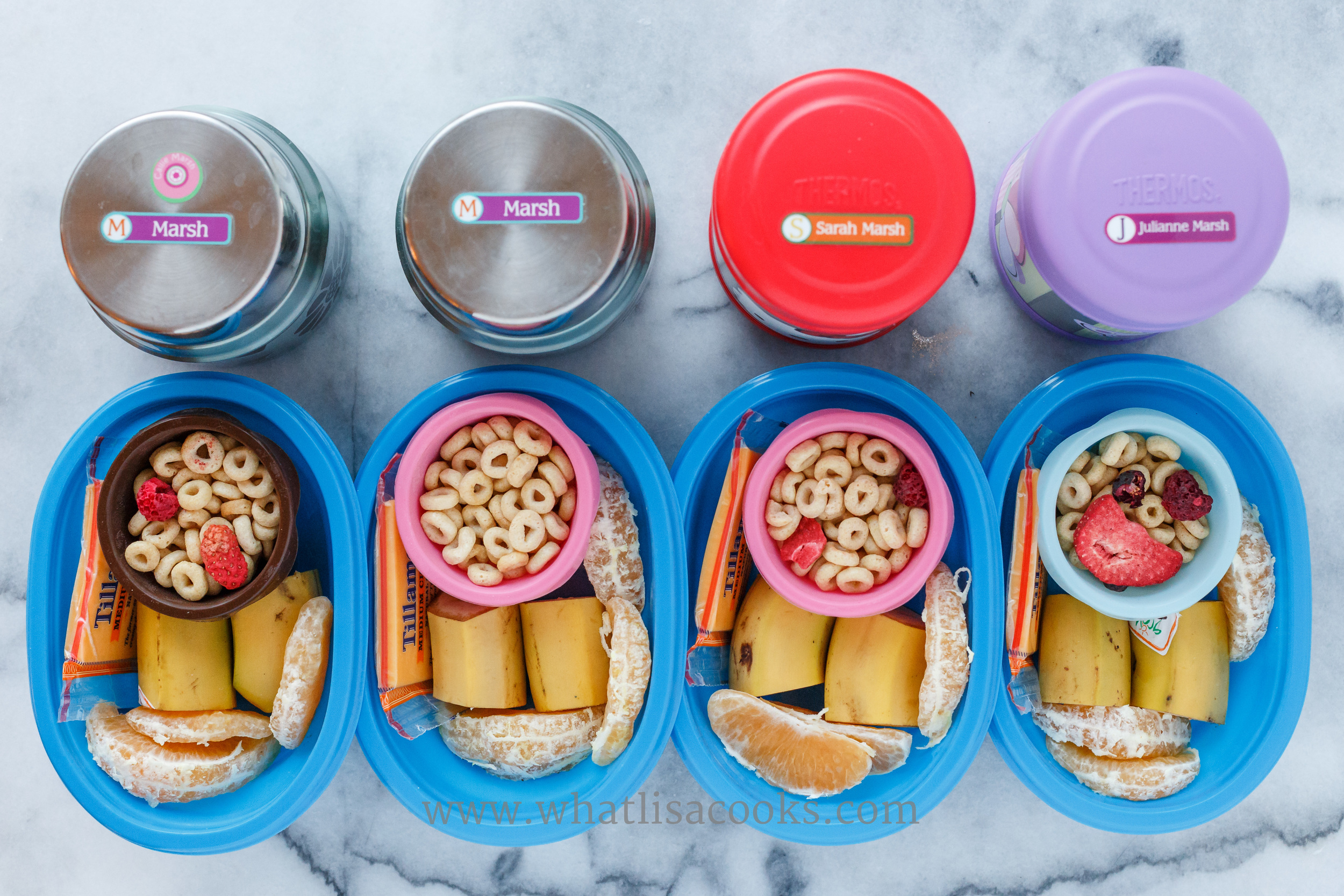 Breakfast for lunch. Homemade instant oatmeal in the thermos containers, cheerios with dried fruit, bananas, oranges, and cheese. 