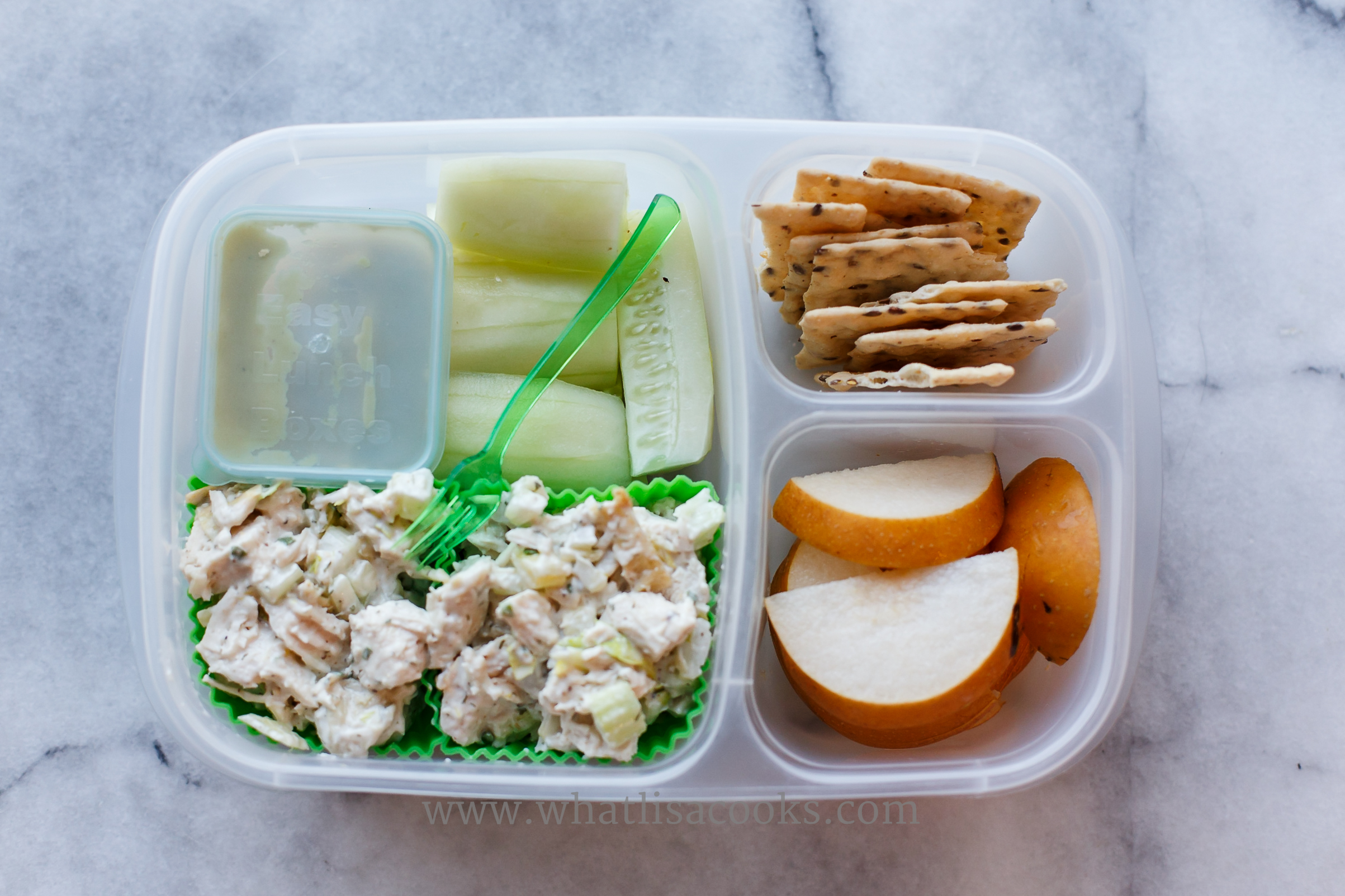 Tarragon chicken salad, cucumbers, guacamole, pears, rice crackers. 