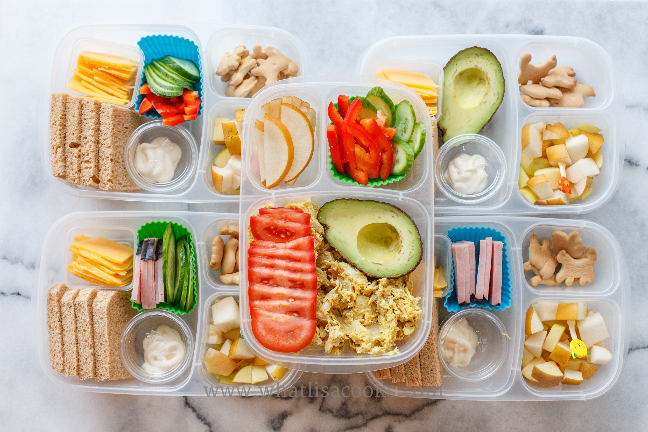 The one on the top middle is grain free: curry chicken salad, tomatoes, avocado, peppers, cucumber, pears. The others have bread and cookies, but this could be made gluten free with gluten free bread and cookies. 