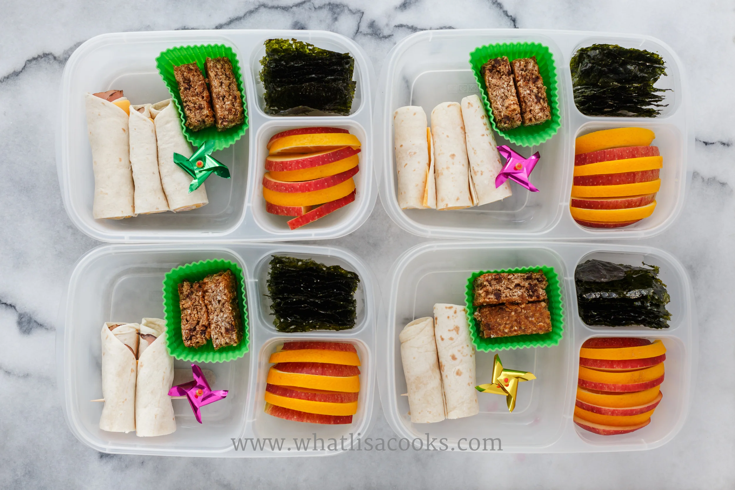 Rolled quesadilla, apples, seaweed snacks, granola bar. 