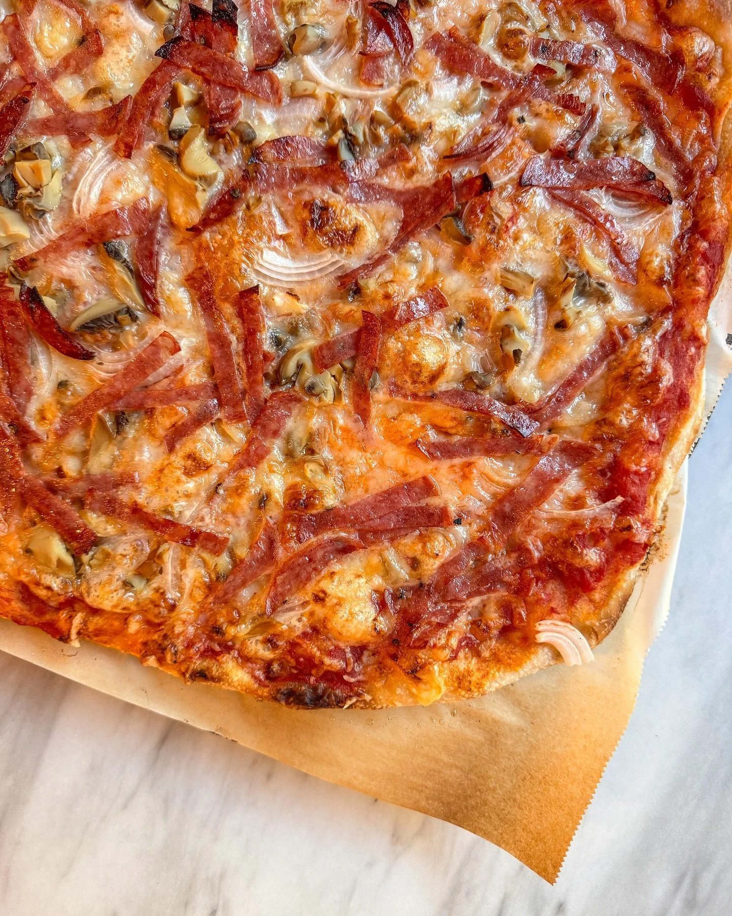 Salami, mushrooms, and onion pizza on my homemade sourdough crust.