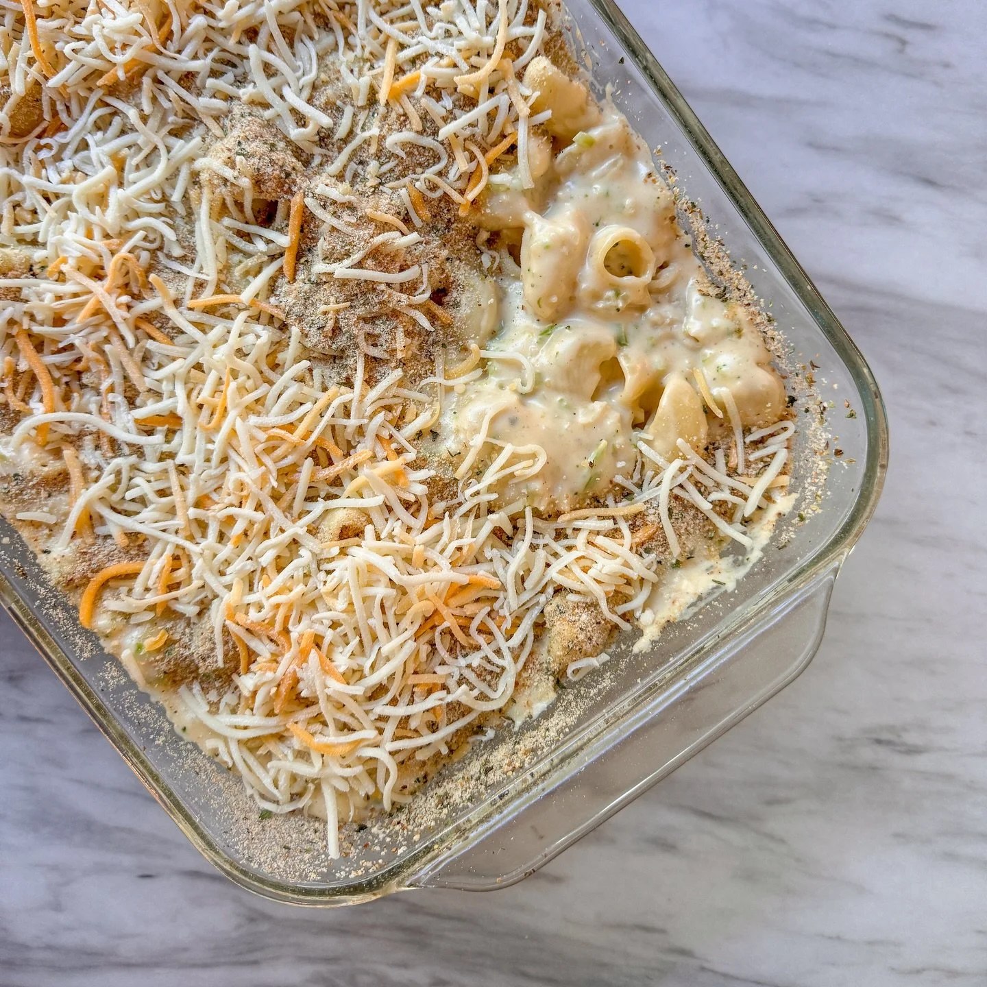 Headed for the oven for dinner tonight: I made a quick cheese sauce (which is just a white sauce with a bunch of cheese melted in), added a package of frozen riced broccoli, mixed in two different shapes of leftover cooked pasta, and dumped it all in