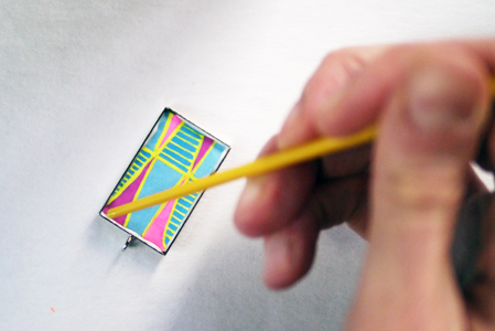 Make sure to press down the corners and edges. You can use the end of your paint brush.