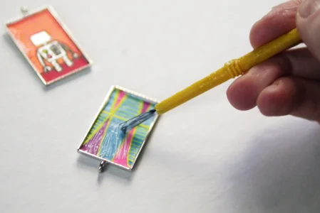 Coat the top of your image with Mod Podge.