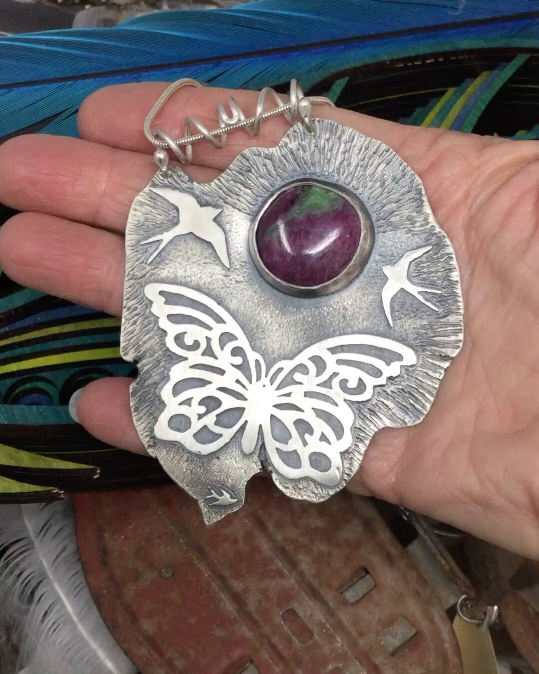 This piece really makes my heart sing. I started with scrap Argentium Silver, melted it into a ball and put it through the rolling mill until I got this big organic shape. I pierced the butterfly then pierced/sawed out a bunch of swallows. I absolute