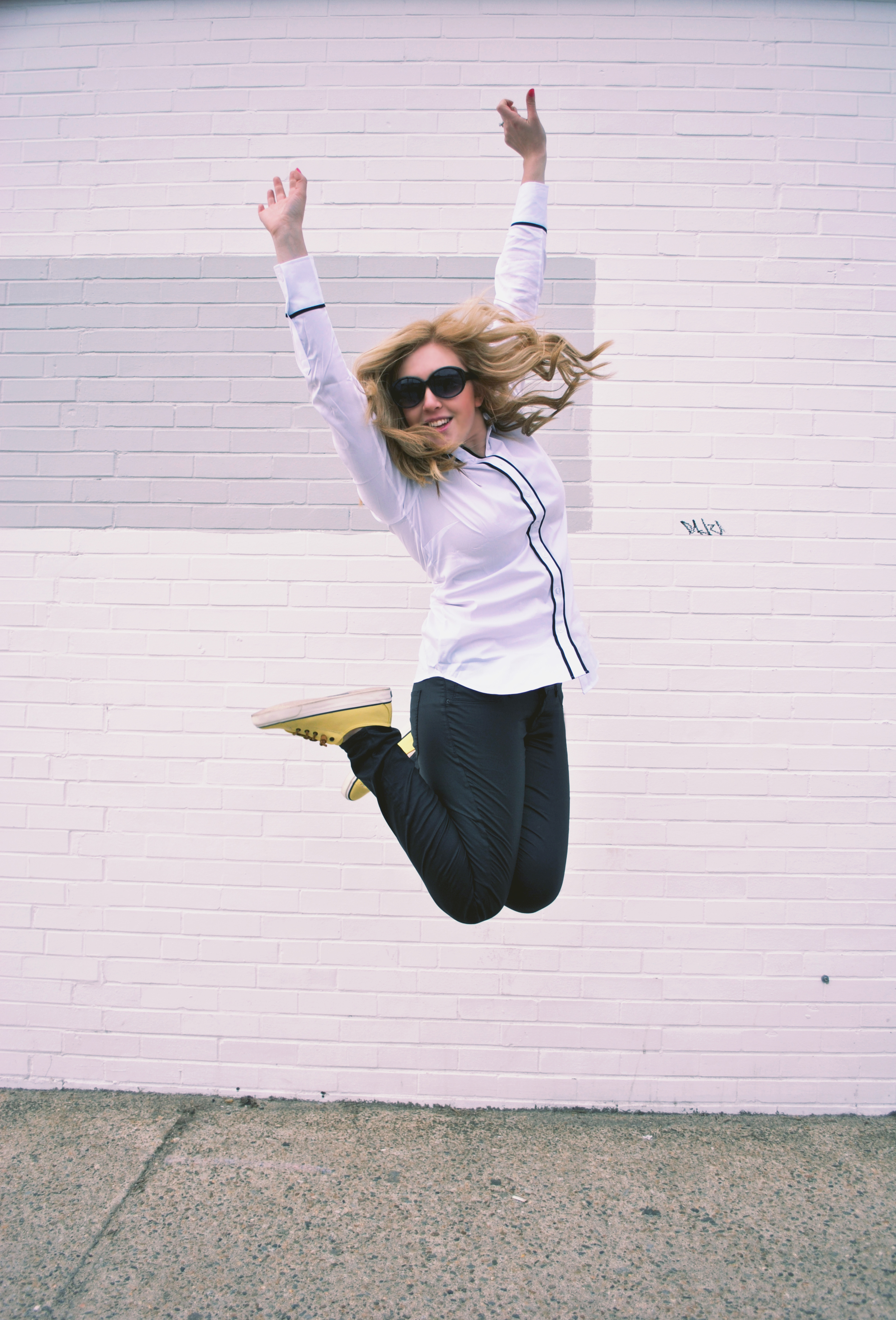 jumping for joy | thoughtfulwish // leather pants // ann taylor // white shirt // leather jacket // yellow sperrys