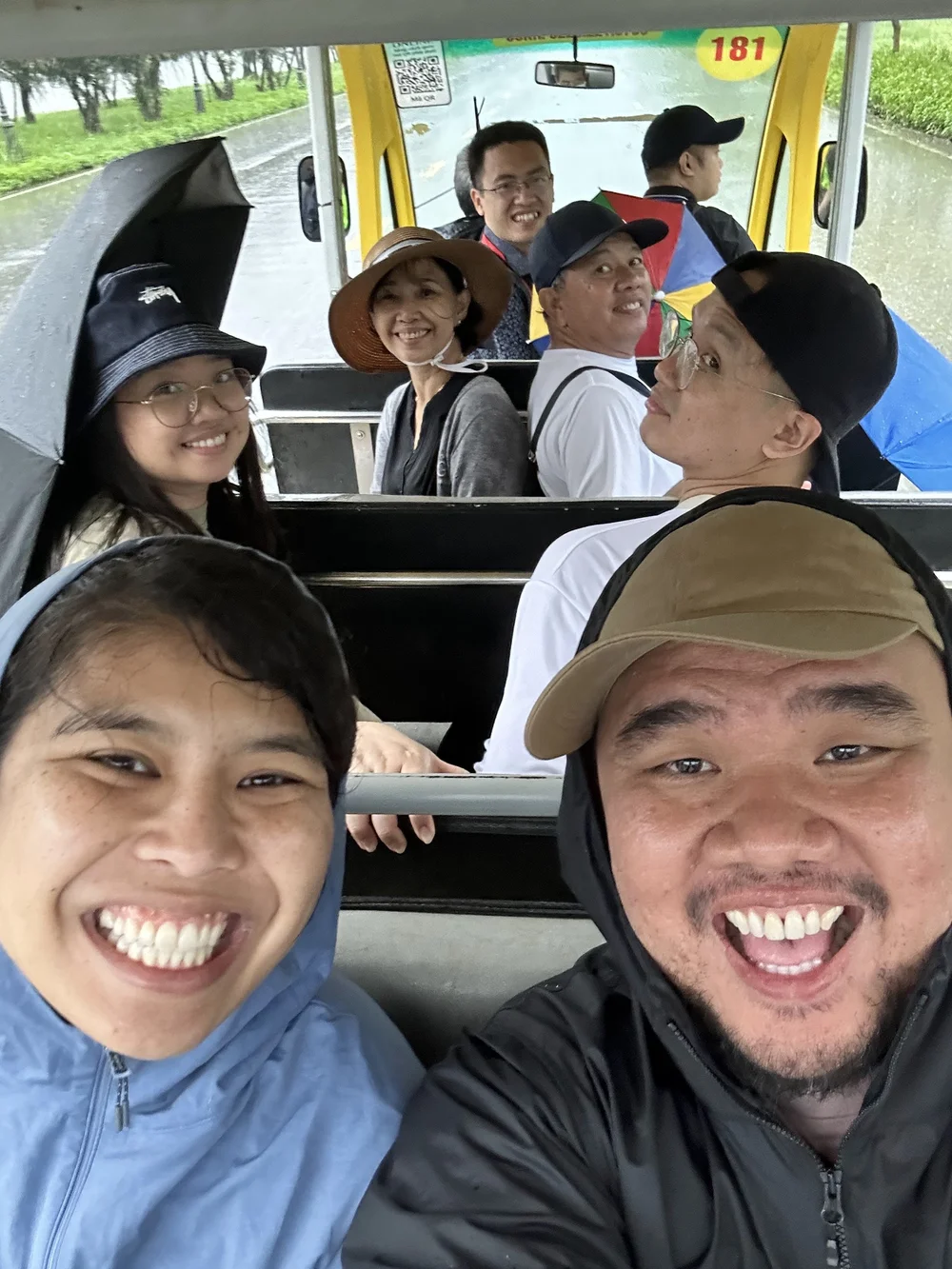  The family and our tour guide in an electric van bringing us back to the entrance of Tam Chúc. 