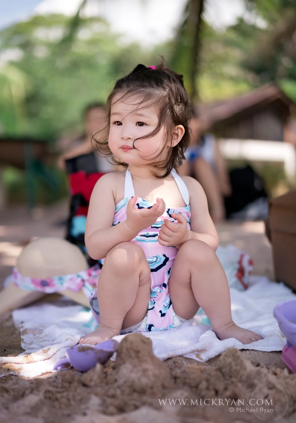 Our daughter did not like the sand on her toes so she stayed on the blanket for the entire visit. 