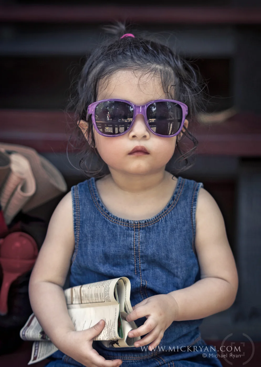 Here she looks like a little old lady at the betting track that is not winning. The highlight of her trip to the zoo was not the animals but the zoo map which she still looks at daily.