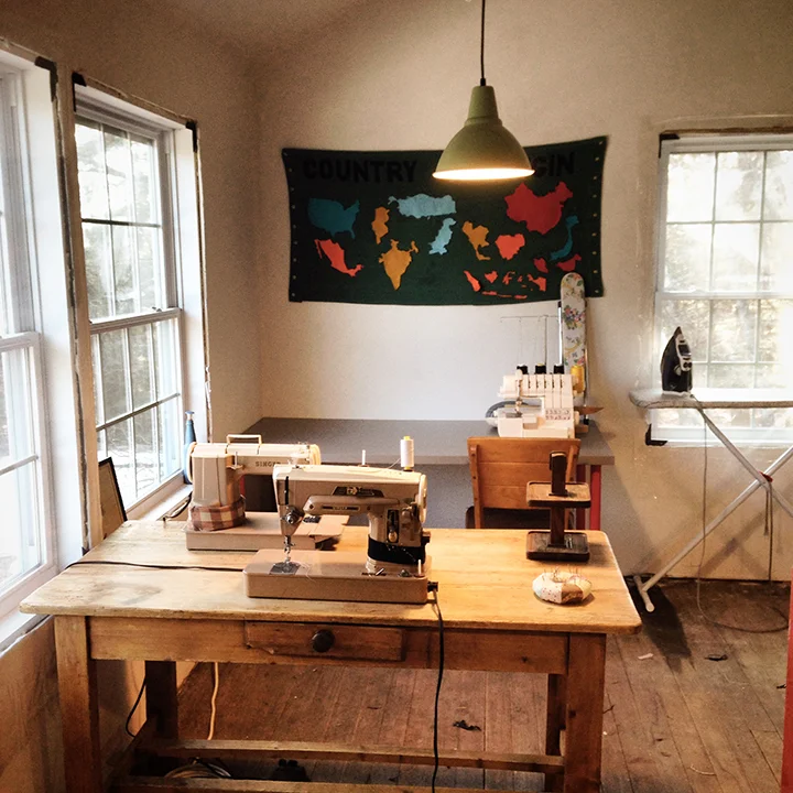 Two sewing desks, 2 of 5 vintage straight stitch/zig zaggers pictured. We still need to frame out the windows...right now they're still covered in winterizing plastic.