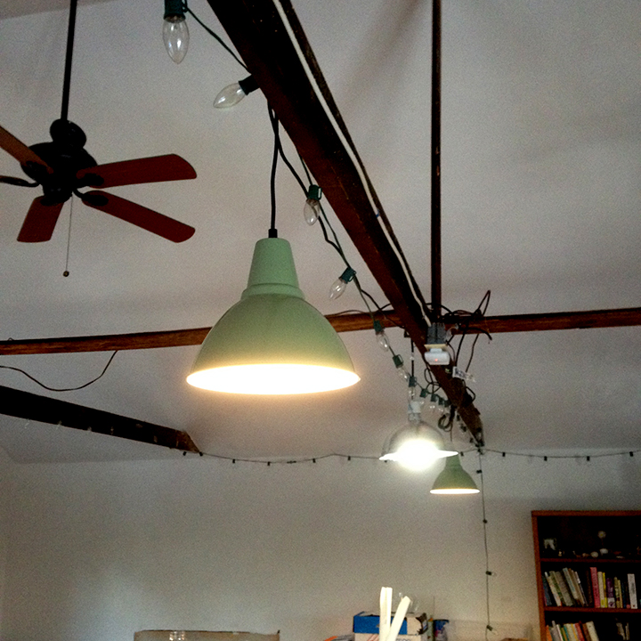 The little white thing in the outlet is a remote controlled outlet. This way I can use a remote to switch on all my plugged in pendants.