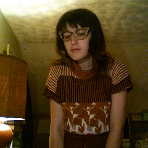 This was a crazy sweater dress, plus copper cateye glasses.