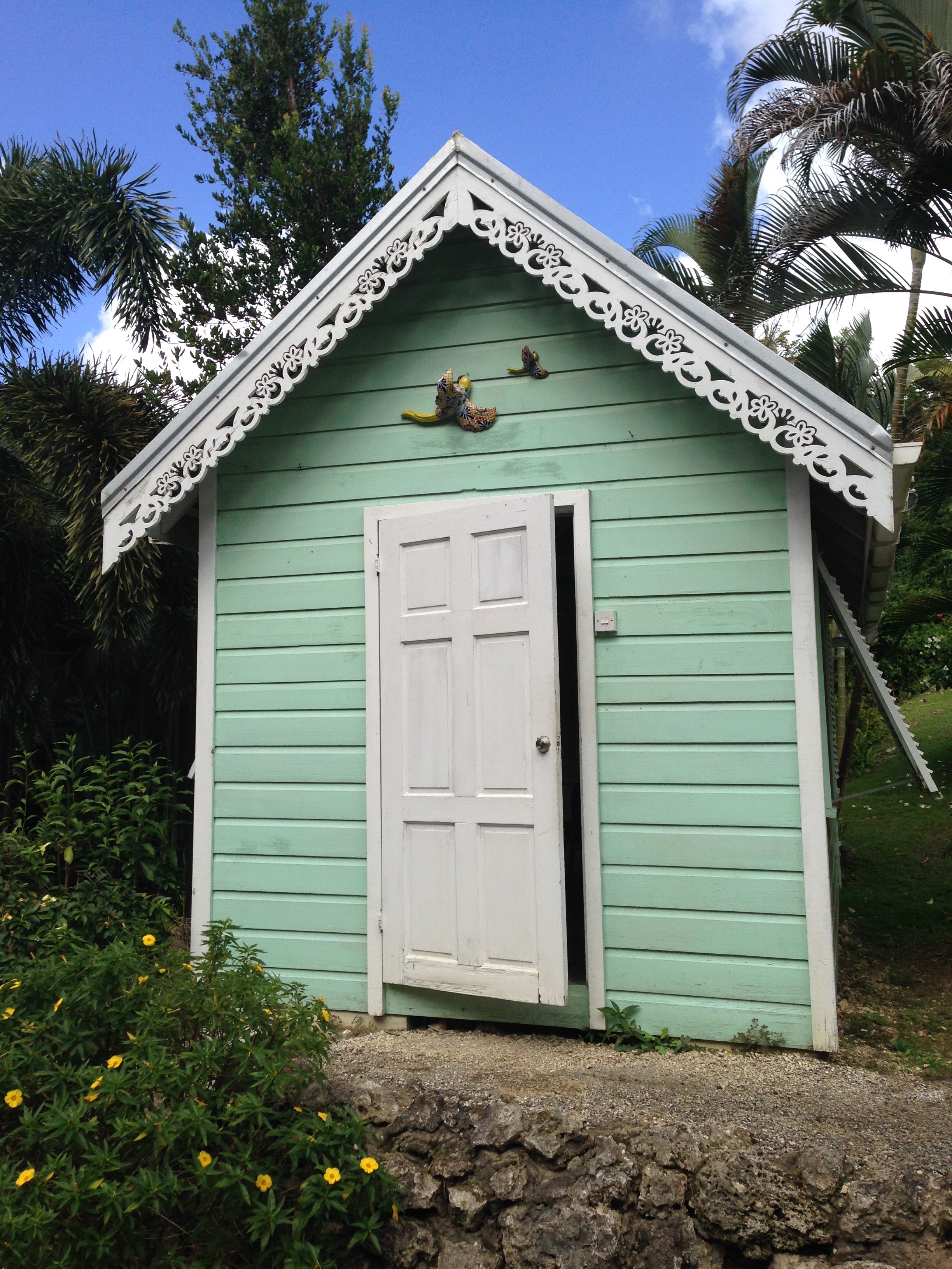 A tiny building with scroll work in Barbados