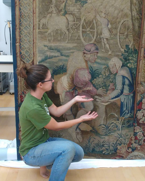 A restored tapestry with an agricultural theme.