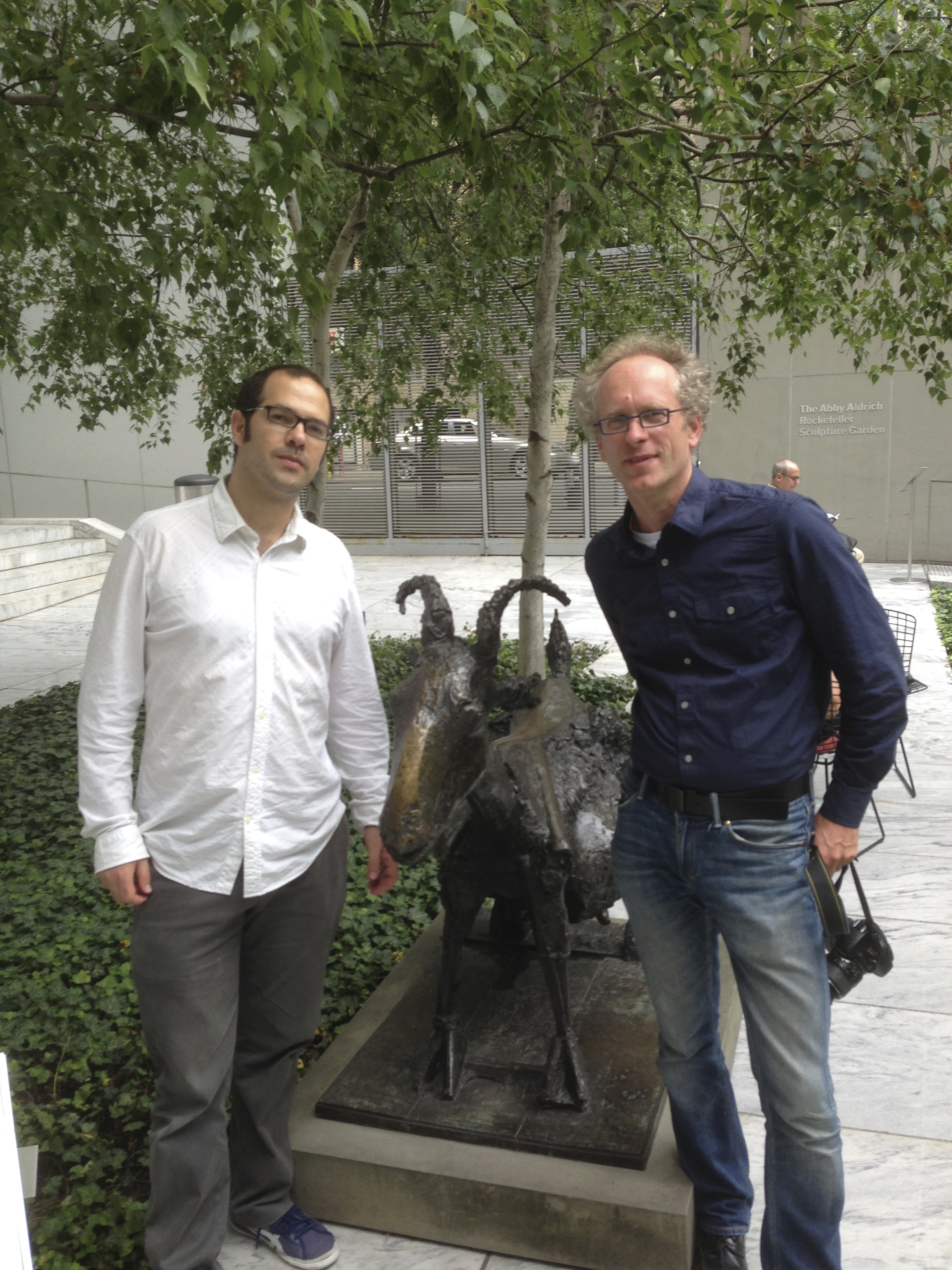 Both authors in front of a Picasso goat sculpture.