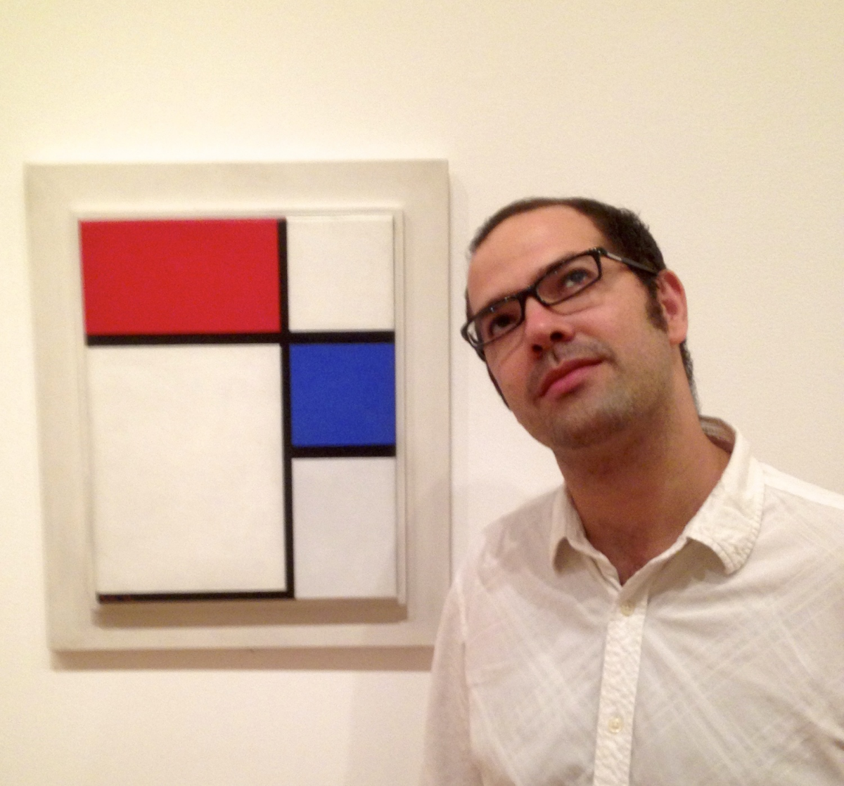 Iddo Tavory, contemplating, in front of a picture used in the book.
