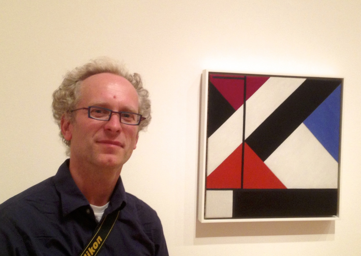 Stefan Timmermans, in front of another painting used in the book.