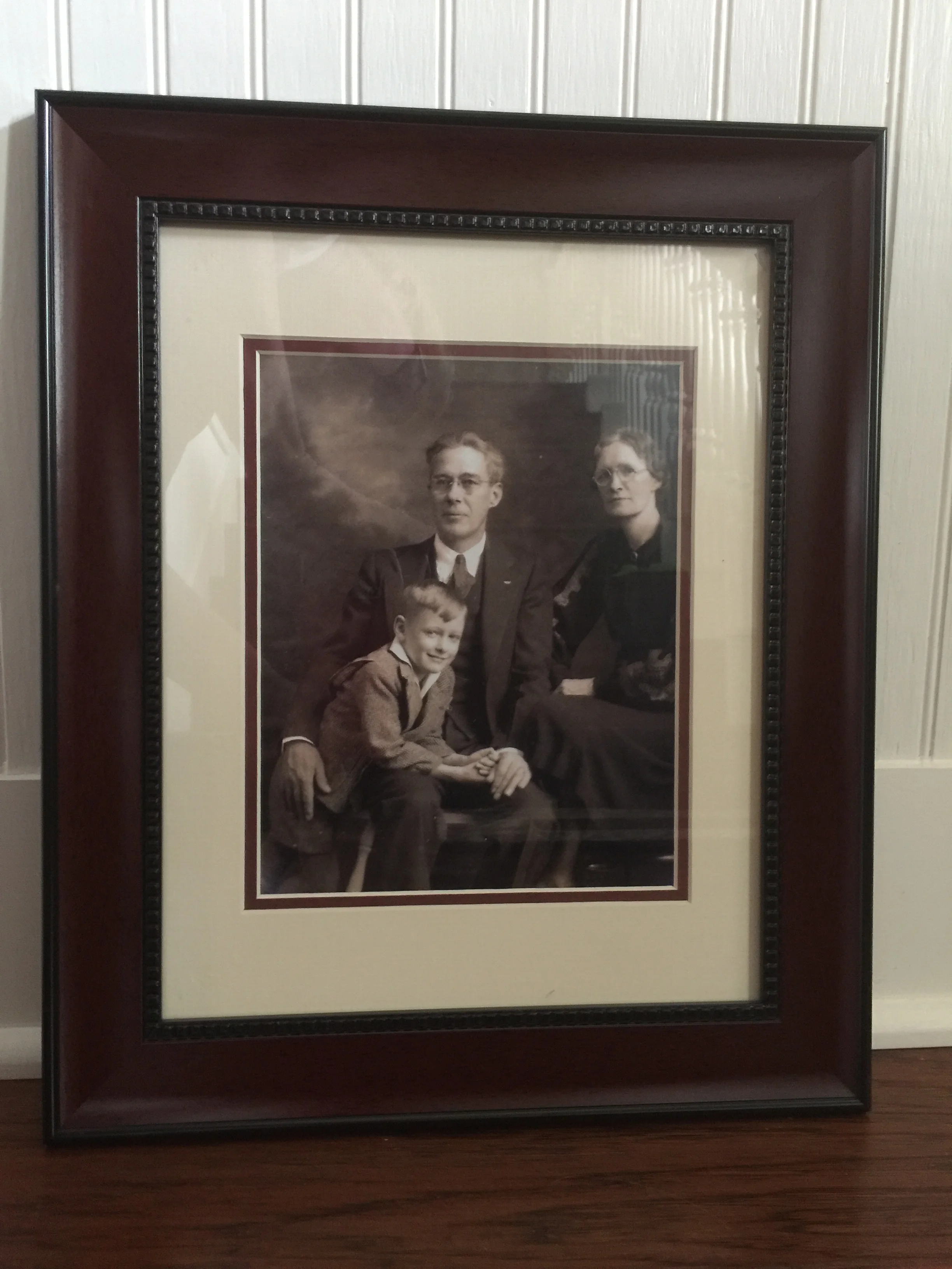 My father and his parents. I scanned the original photo and printed this heirloom photograph.
