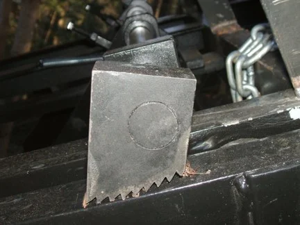 The 4140 steel brake dogs have aggressive heat-treated teeth that dig into the track and hold the car.