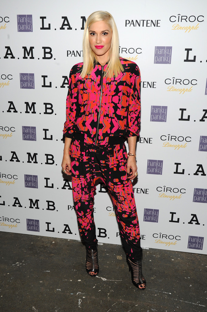 This look is so sleek and modern. We love the bold neon print and the complimentary lip color! Funky jumpsuits are a great alternative to a dress.