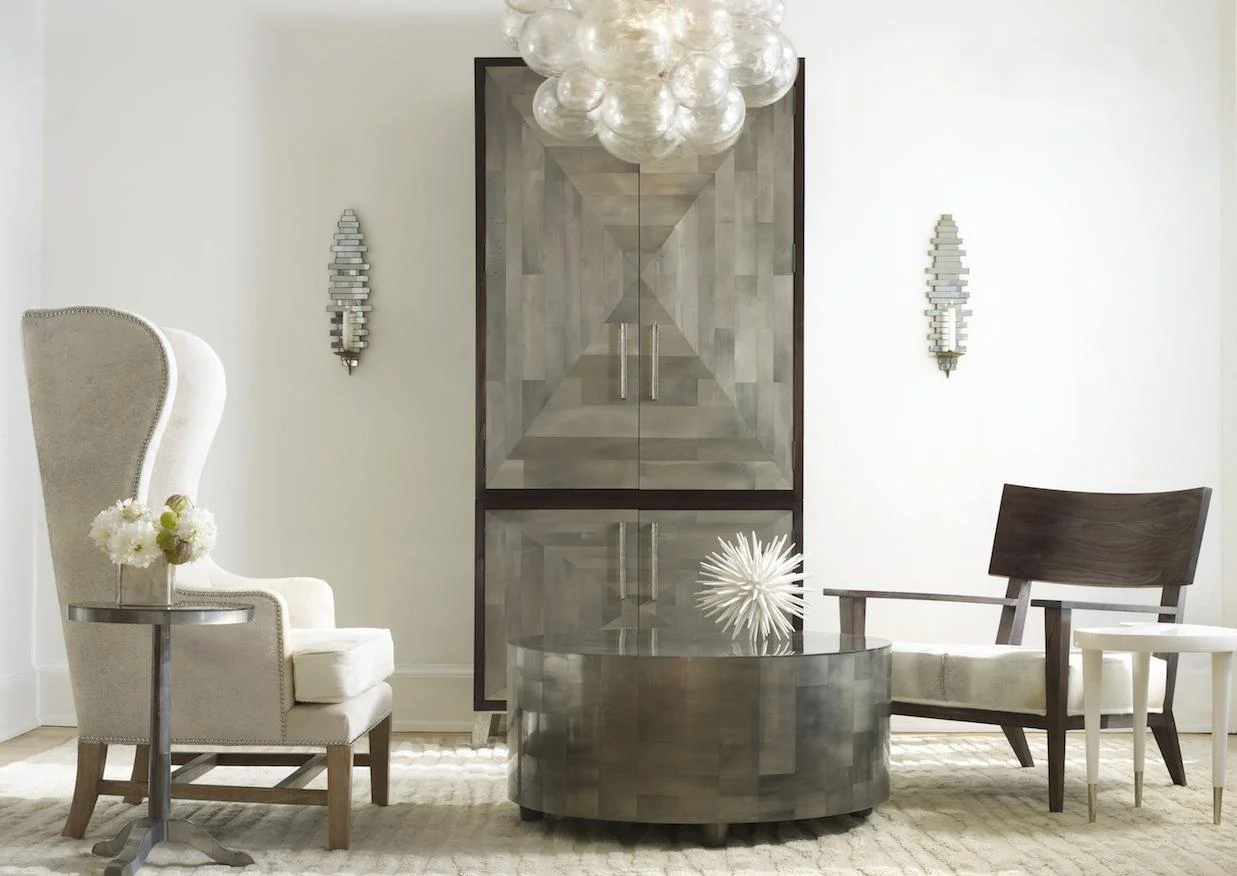 PARKER ROOM FEATURING: Adeline Side Table , Large Adeline Cocktail Table , Parker Armoire , Guy Chair with custom gray cowhide seat, Muriel Chandelier