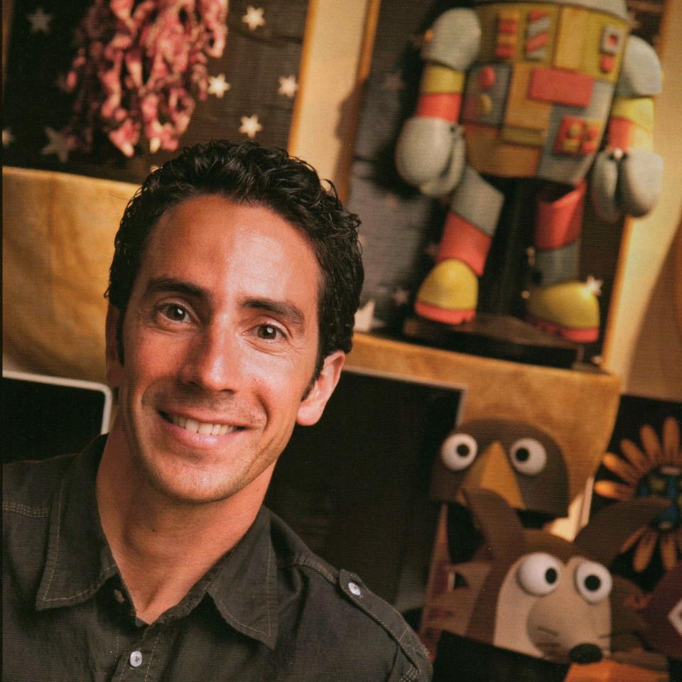 (Above) McAvene as featured in Seasons Magazine. (Below) McAvene plays guitar in front of one of his backdrops. (Middle) McAvene's son Ben. (Right) McAvene in a tree costume he and his brother and mentor created for a Mongoose Bicycle commercial.