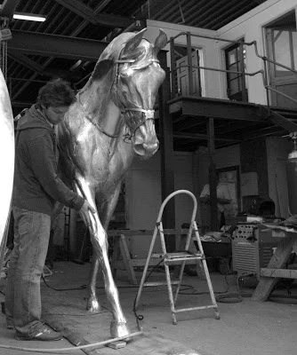  Langton inspecting the bronze cast of Yeats at the foundry. 