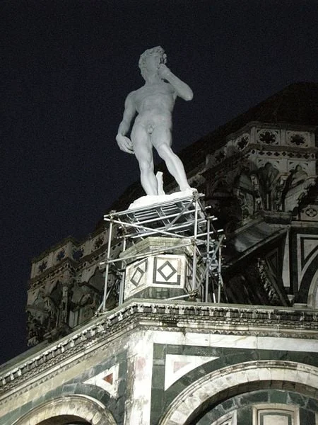 Resin copy of David, in original siting atop the buttress of the Duomo, Florence.
