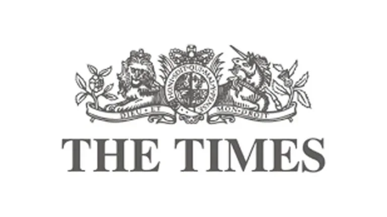 Black and white logo of The Times newspaper featuring a crest with two lions, a crown, and the words "The Times" in bold font.