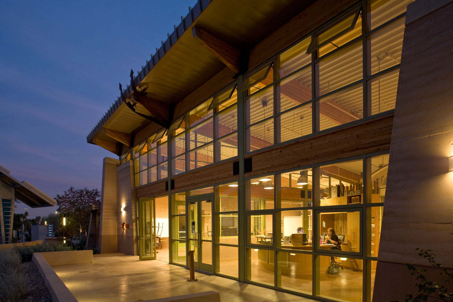 These massive earth walls, some of them three feet thick and thirty feet tall, are composed of a single aggregate - a sandy decomposed granite sourced just south of town. The rammed earth walls were constructed by Benchmark Development, with the three Rammed Earth Works partners providing training, supervision, and experience qualifications. Image provided by Lucchesi Galati Architects.