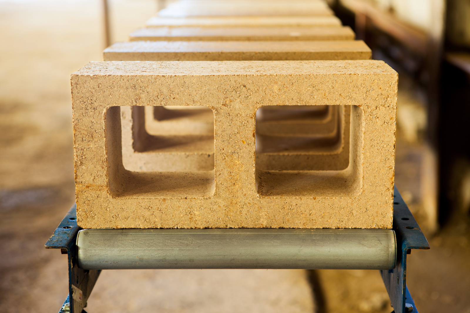 Watershed Block coming off the production line in the pilot factory in Napa, California. Watershed Block are the same size and offer the same structural characteristics of a traditional concrete block while using half the cement and using recycled material in place of virgin mined rock. Find out more at the Watershed Materials website.
