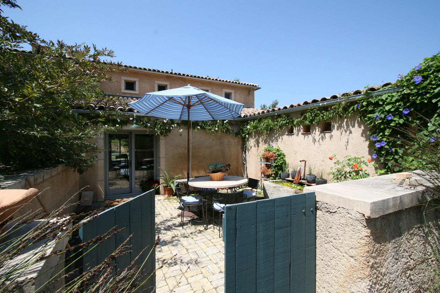 The eastern sun fills this kitchen courtyard in the early mornings. Eggs benedict on a cast earth table, a pinch of cilantro from the potted herbs, the smell of an espresso, and the quiet sound of spring water cascading into the carved stone basin. Bienvenue a terre!