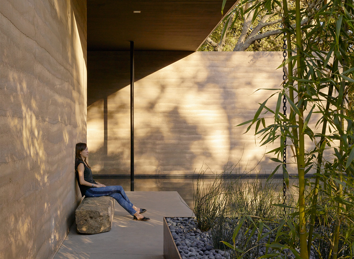 Butt on a boulder, back to the wall, sun on the pond. If I were a Stanford student would I come to Windhover or go to class? Image © Matthew Millman