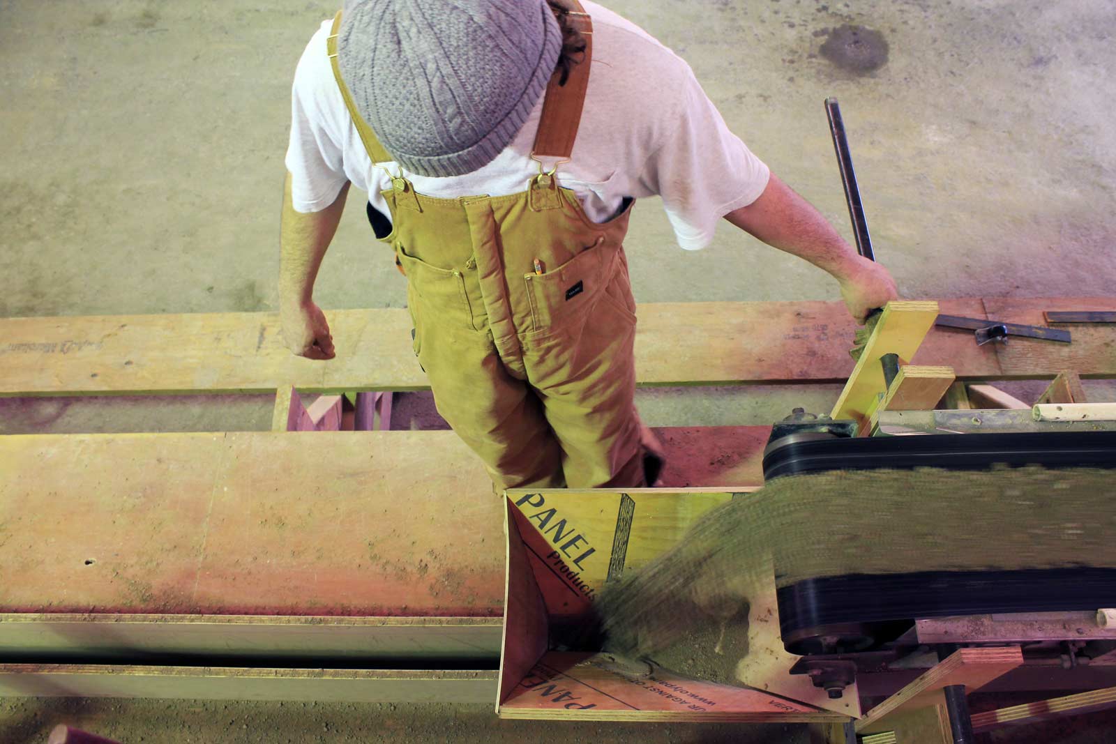 Working with panels this thin, delivering the soil mix into the formwork at a uniform depth is essential. The team at Rammed Earth Works continues to develop equipment specifically suited to the task at hand. Here we’re using a linear traveling delivery conveyor dropping mix through the feeding box - three linear feet every fifteen seconds; 2.4 cubic feet per lift.