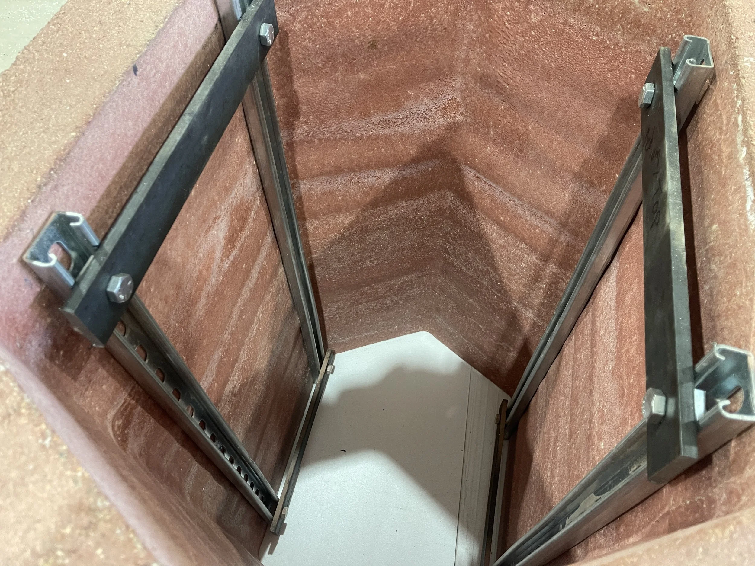  The client required  an easy way to lift each base into place as their turnaround for installing these was quite quick as well. We came up with this mini-frame that bolted into the walls and could be lifted with straps through the top flat bar.  