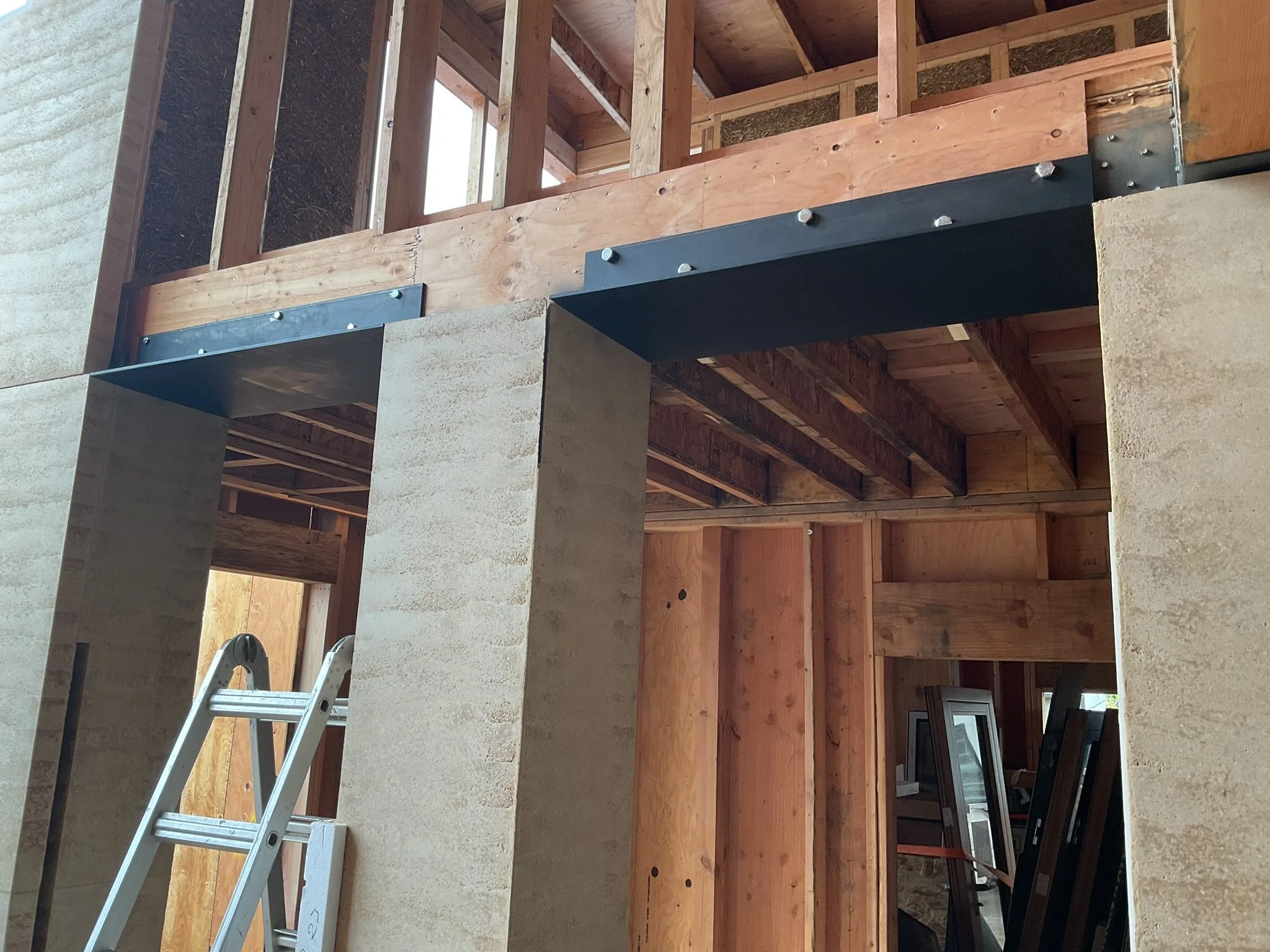  In areas where panels are not sitting on the foundation, a ledger must be installed to carry the panel weight. Here you'll see a before picture of the ledgers installed prior to placing the above walkway panels.  