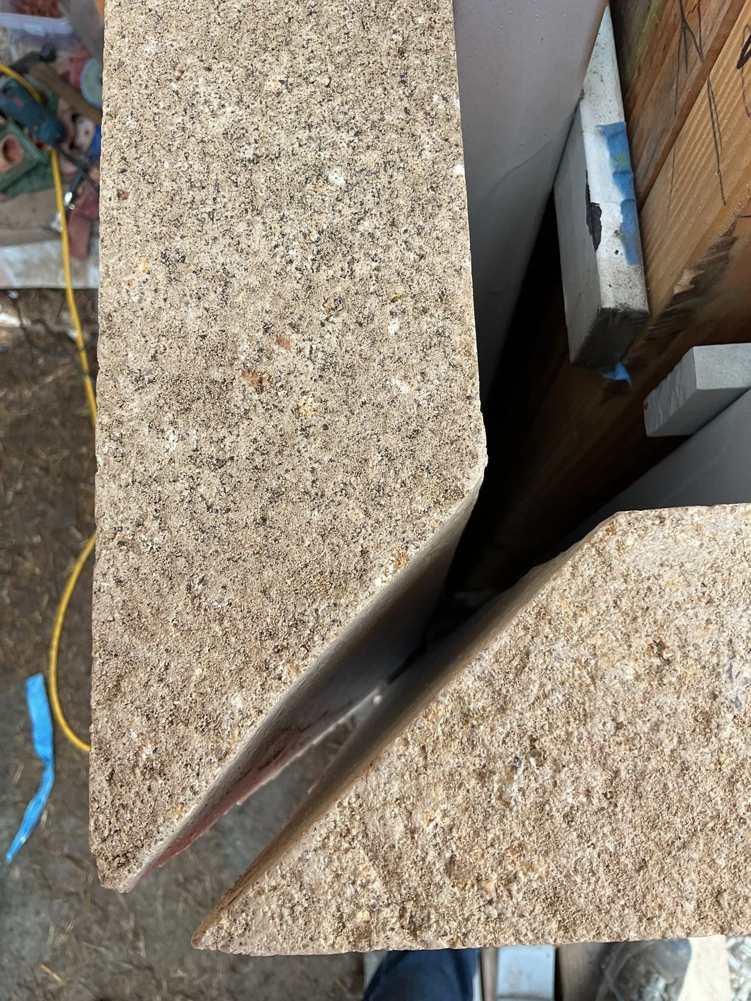  All the mitered corners on this project were filled with a combination of a matched-color sanded grout and the source material to ensure the best color match. Patching and filling seamlines can be an art, so it is important to ensure your install te