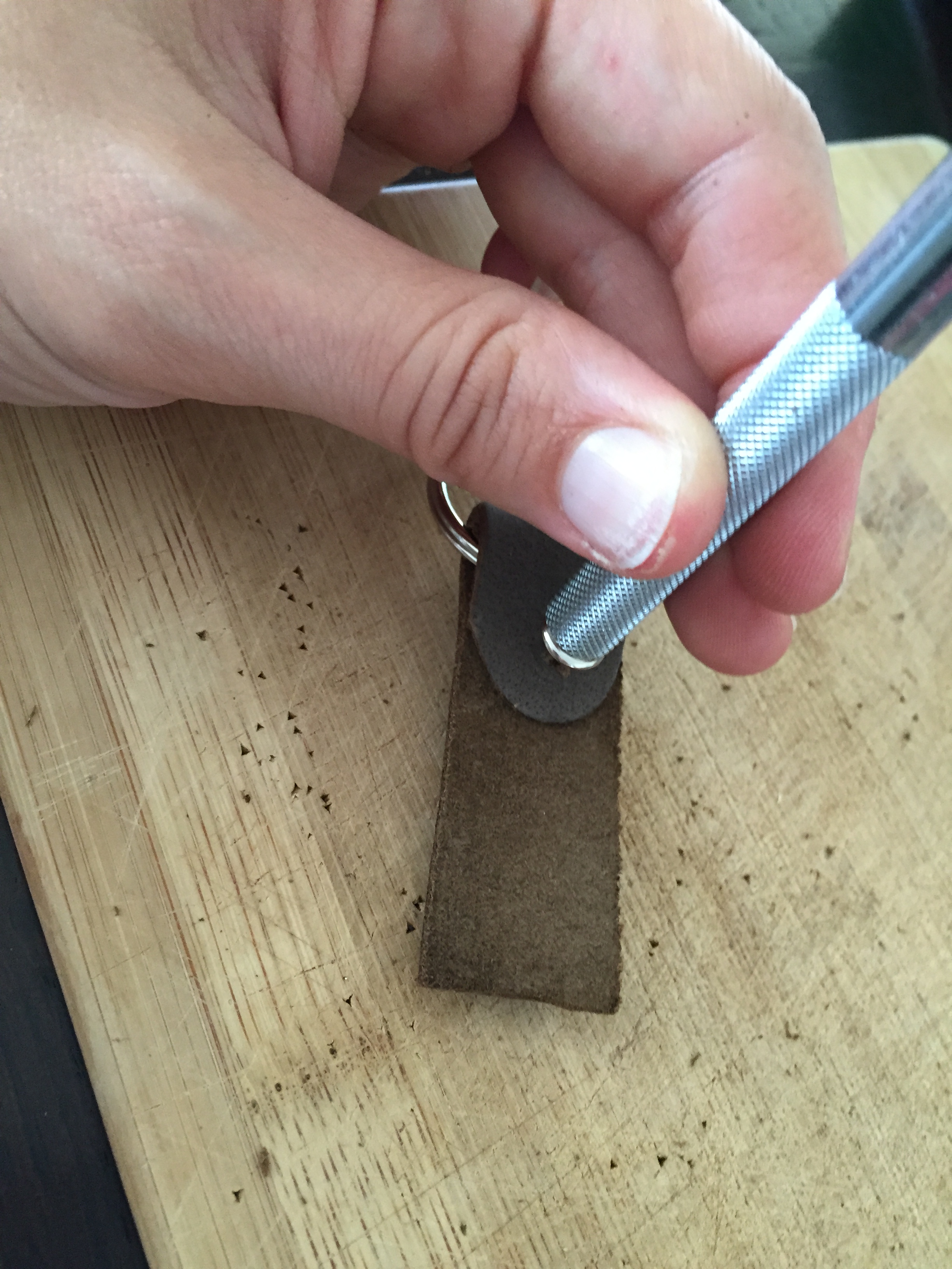  Place the flat part of the rivet on the other side, place the pointy rivet on the&nbsp;anvil so the flat part is facing up, put the setter on top, and strike with the mallet a few times, enough to secure the rivet. Be sure not to go too far or the w